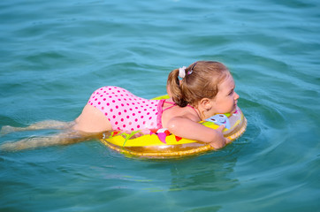 Girl swimming on the lake