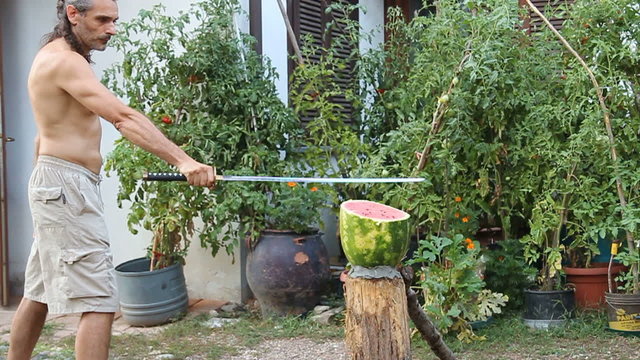 cutting up a watermelon with a samurai sword