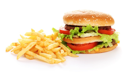 Big and tasty hamburger and fried potatoes isolated on white