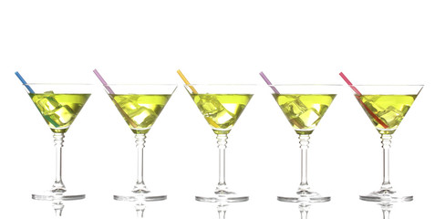 Yellow cocktail in martini glasses isolated on white