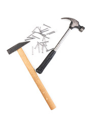Hammers and metal nails isolated on white