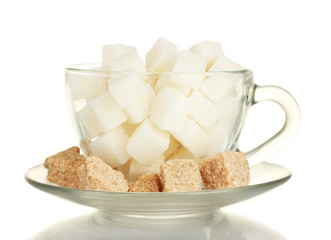 white refined sugar and Lump brown cane sugar cubes in glass