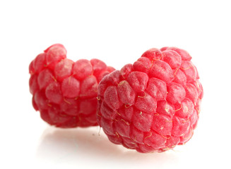 ripe raspberries isolated on white