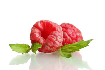 ripe raspberries with mint  isolated on white