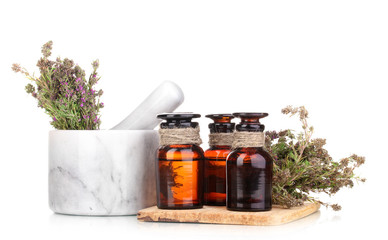 Thyme herb and mortar isolated on white