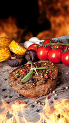 Delicious beef steak with vegetable on wooden table
