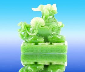 Green Pixiu on a white background, Chinese lucky animal mascot