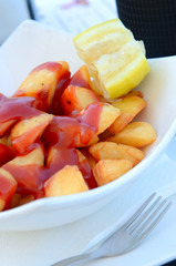French fry with ketchup  in white plate