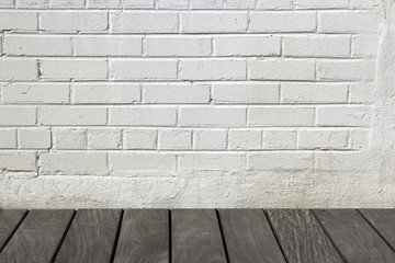 White brick wall with wooden floor