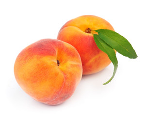 Fototapeta na wymiar Sweet peaches with leafs