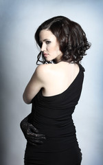 Fashion portrait of a young beautiful dark-haired