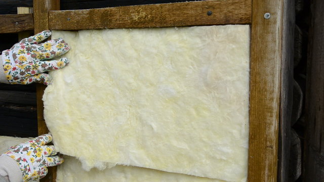 mineral rock wool insulation on ancient wooden  house wall