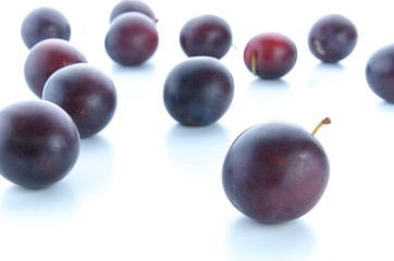 Prunes on white background