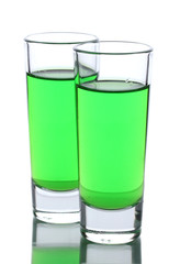 Two glasses of absinthe isolated on white