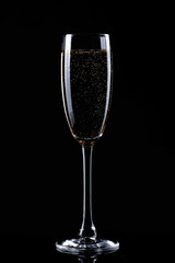 glass of champagne on black background