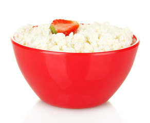 cottage cheese in red bowl with strawberry isolated on white