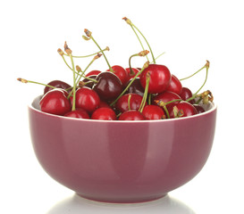 fresh cherry in violet bowl isolated on white