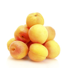 ripe apricots isolated on white