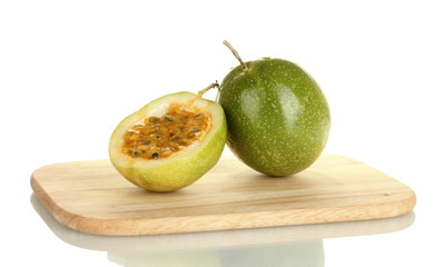 green passion fruit isolated on white background close-up