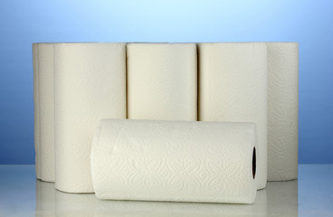 rolls of toilet paper on blue background