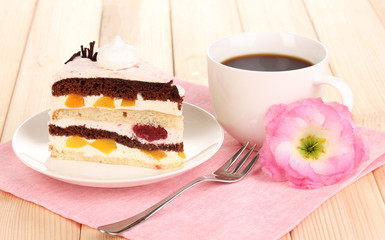 Layered fruit cake on wooden table