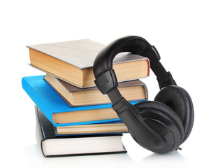 Headphones on books isolated on white