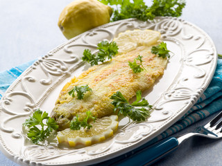 breaded sole fish with parsley and lemon