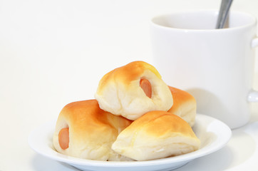 Sausage dough and coffee cup