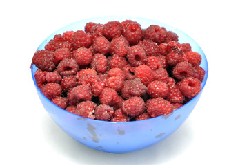 Raspberries in a blue bowl