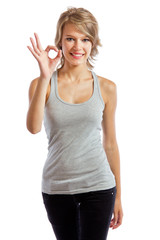 Fototapeta premium Happy young woman doing the ok sign