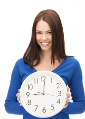 woman holding big clock