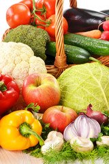 Wicker basket and grocery isolated on white