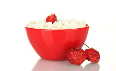 cottage cheese in red bowl with strawberry isolated on white