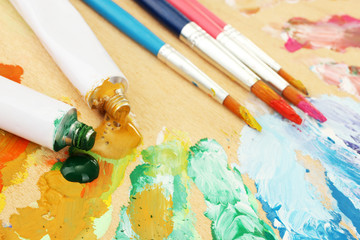 Fototapeta premium Abstract acrylic paint, paint tubes and brushes