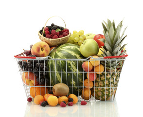Assortment of exotic fruits in metal basket isolated on white