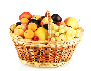 Still life of fruit in basket isolated on white