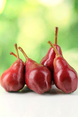 Ripe red pear on nature background