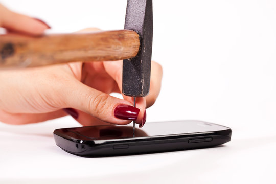 Hammer in hobnail into cellphone