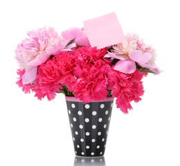 beautiful spring flowers in cup isolated on white