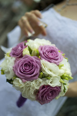 Bride holding an elegant bouquet or bunch of flowers