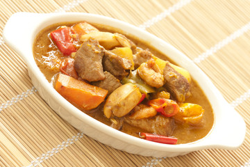 Delicious pork curry with squid on bamboo mat