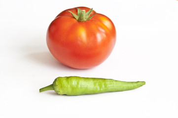 Red chili and red tomato isolated on white background
