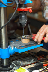 Man working on drilling machine