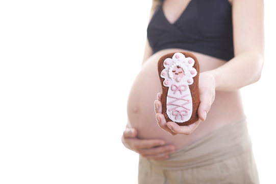 Pregnant woman's belly with funy gingerbread