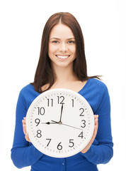 woman holding big clock