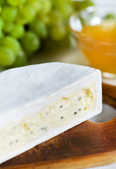 Cheese with blue mould, honey and grape