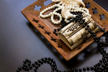 Jewels in a nacreous shell on a black table