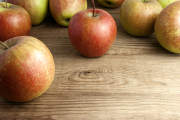 red apples on wooden table