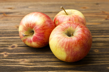 red apples on wooden table