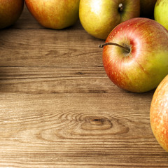 red apples on wooden table